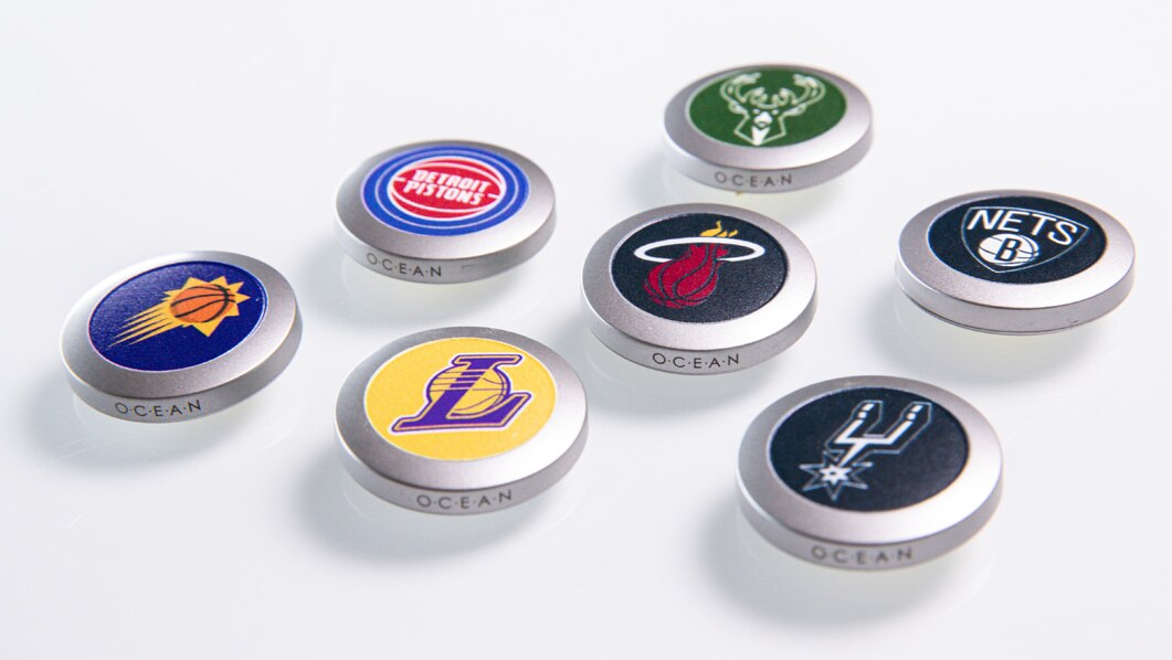 Several Medallions with varying pro basketball logos.