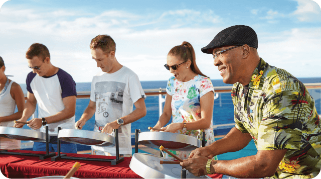 Princess guests experience playing steel drums.