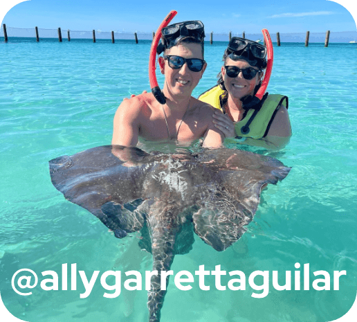 Couple in water on stringray excursion. @allygarrettaguilar .